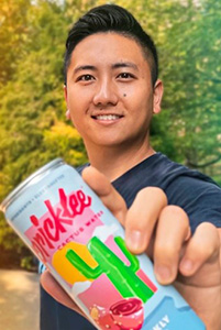 Kun Yang holding a Pricklee Cactus Water can