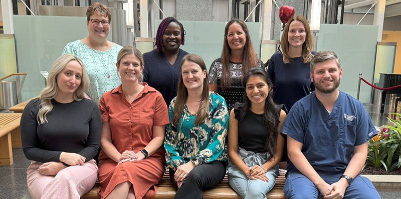 Pediatric pharmacy residents and faculty, four in back row, five in front row smiling